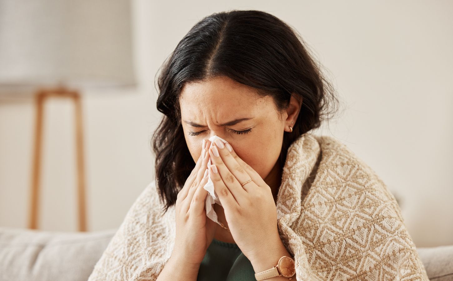 Close-up short of woman with allergies sneezing