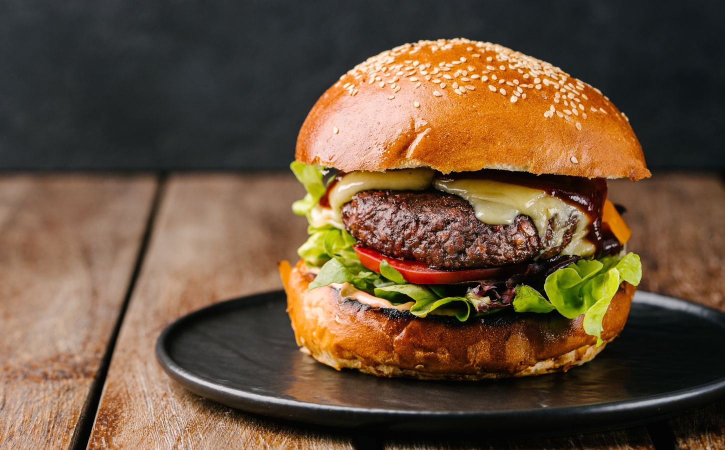 A juicy vegan burger with melted dairy-free cheese