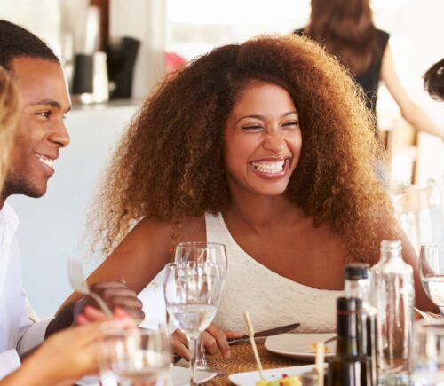 Friends eating dinner at a vegan-friendly restaurant