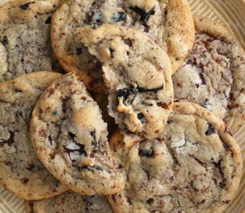 A stack of vegan cookies and cream-flavored biscuits on a plate