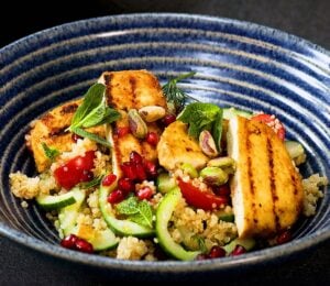 A bowl of vegan halloumi salad made with tofu