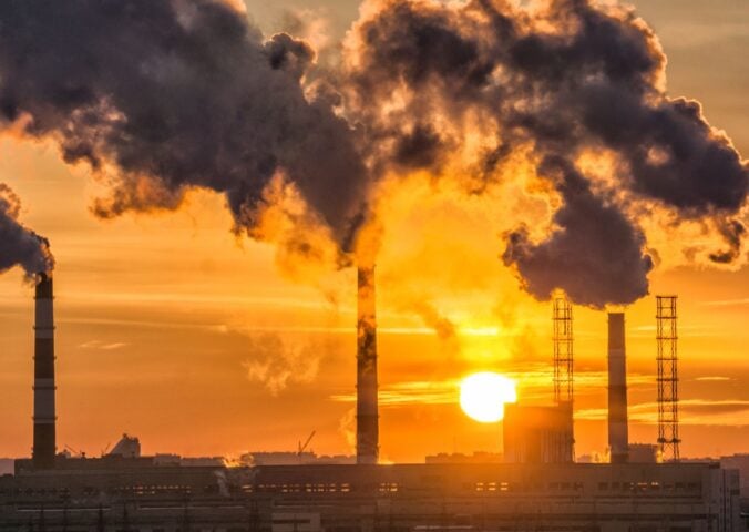 Fossil fuels burning in a factory, releasing environmentally damaging carbon