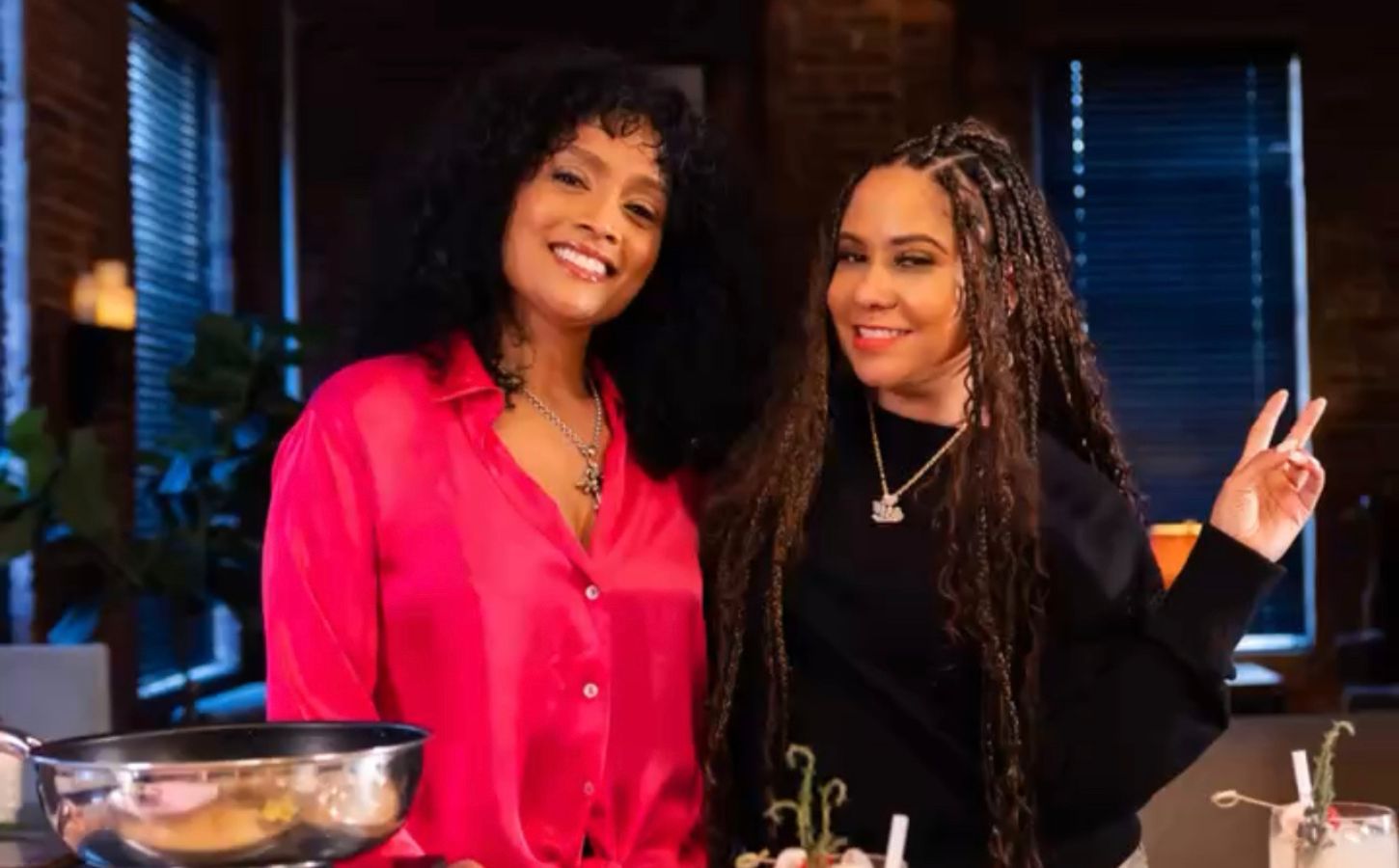 Angela Yee and Charlise Rookwood on the set of the Black Vegan Cooking Show