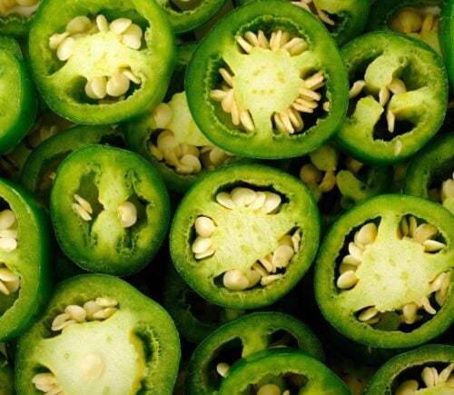 A pile of jalepeno peppers, which are becoming less spicy