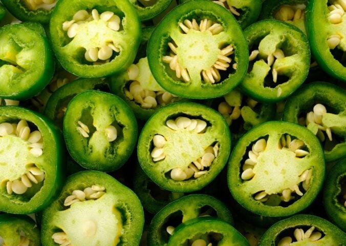 A pile of jalepeno peppers, which are becoming less spicy