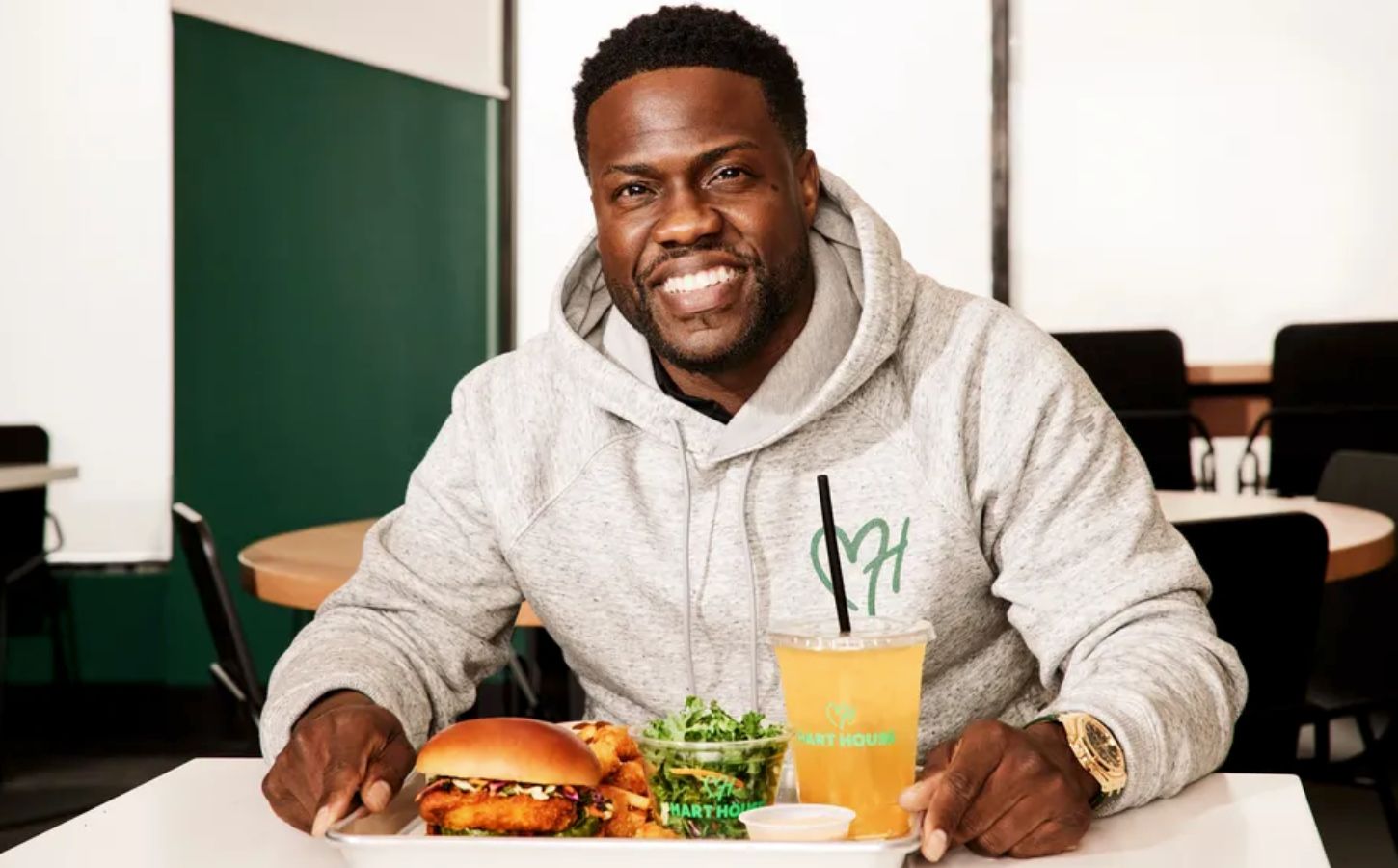 Plant-based celebrity Kevin Hart eating at Hart House, his vegan fast food restaurant chain