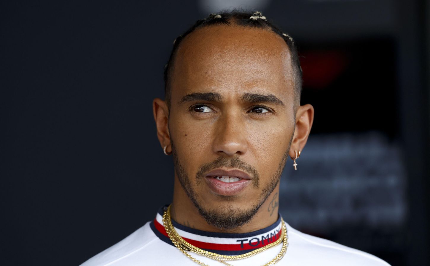 Vegan athlete and entrepreneur Lewis Hamilton looking pensive ahead of a Formula 1 race