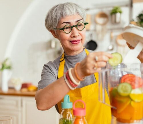 A woman making a plant-based smoothie