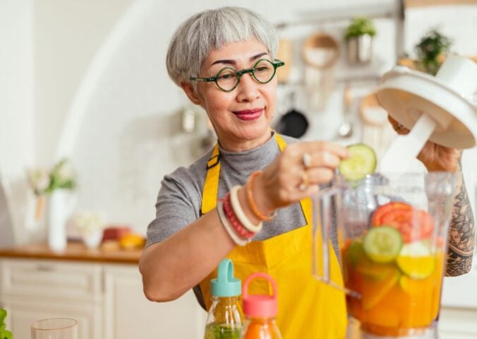 A woman making a plant-based smoothie