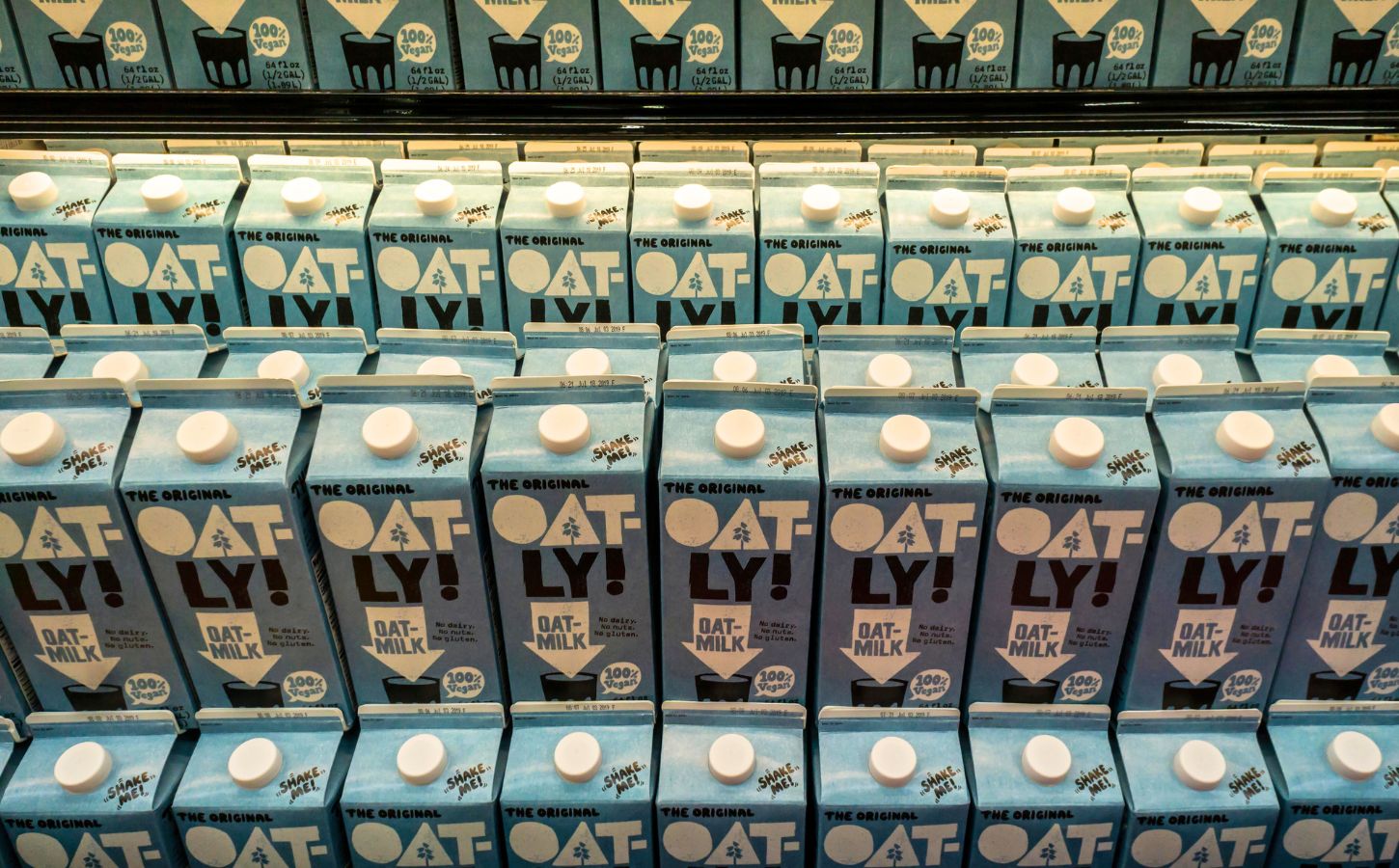 Lines of Oatly bottles, which will now be able to feature the slogan 'Post Milk Generation'