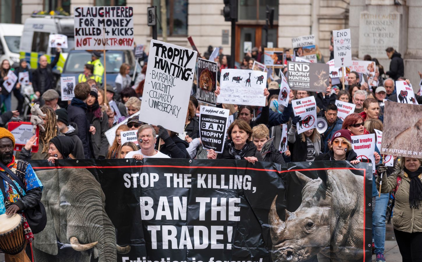 A group of people protesting against trophy hunting