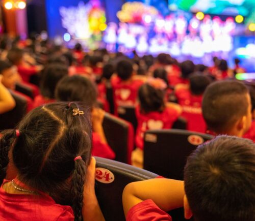 Children in the audience of a stage show