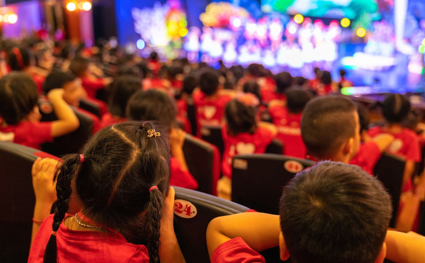 Children in the audience of a stage show