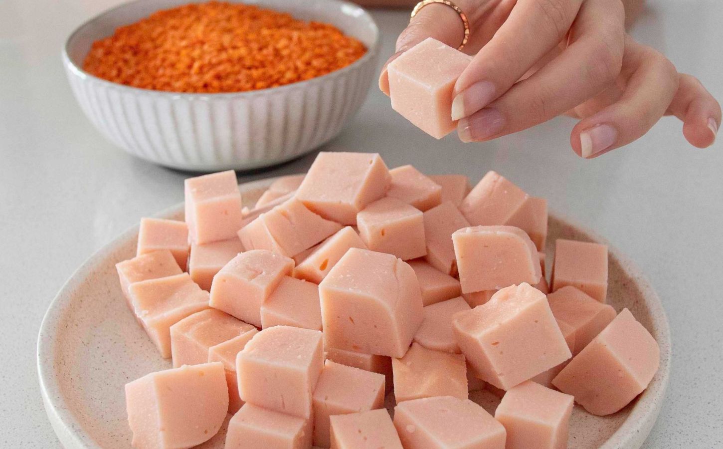 A plate of cubed red lentil tofu made from scratch