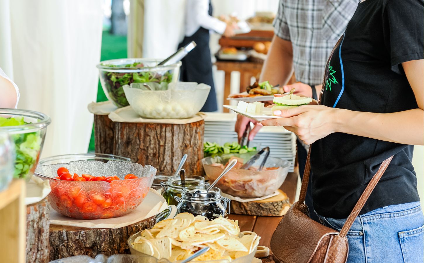 A person serving themselves vegan food at work