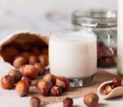 Artistic photo of hazelnut milk, after a study showed swapping dairy to nuts has better outcomes for heart health