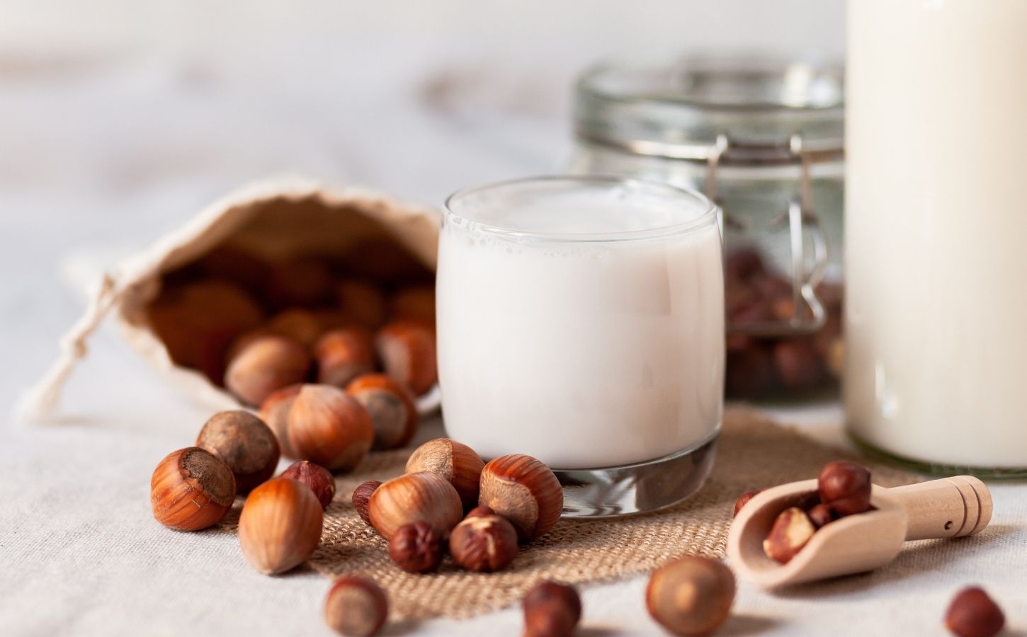 Artistic photo of hazelnut milk, after a study showed swapping dairy to nuts has better outcomes for heart health