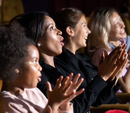 People in the audience at a theater