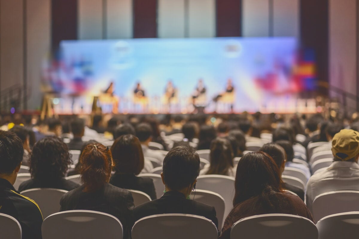 People on stage at a vegan conference