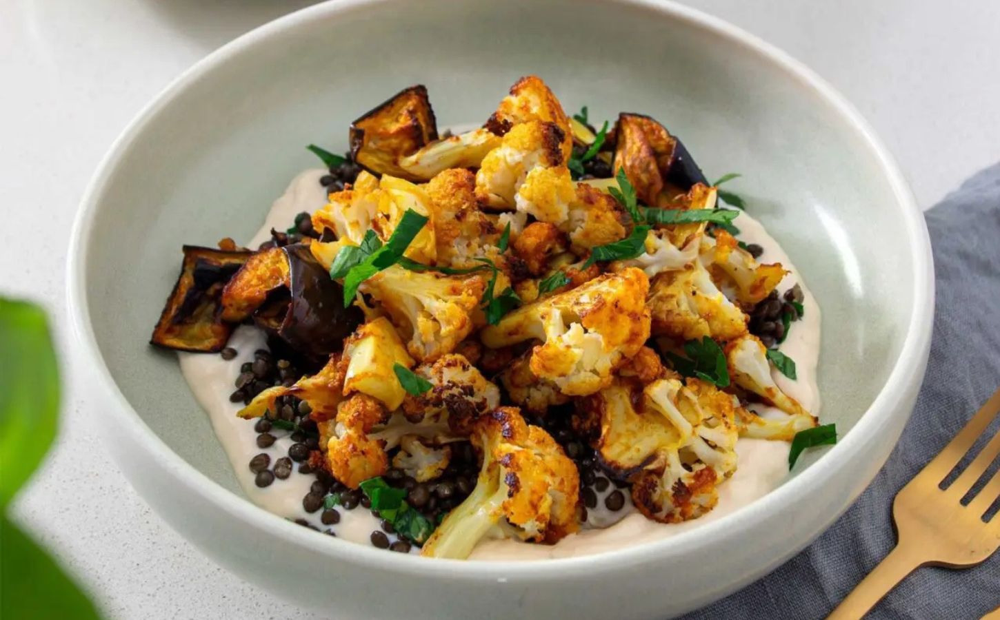 A vegan cauliflower bowl with coconut yogurt