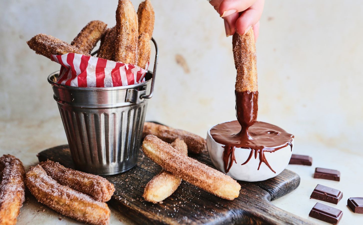 Vegan churros with orange chocolate dipping sauce made from a vegan recipe