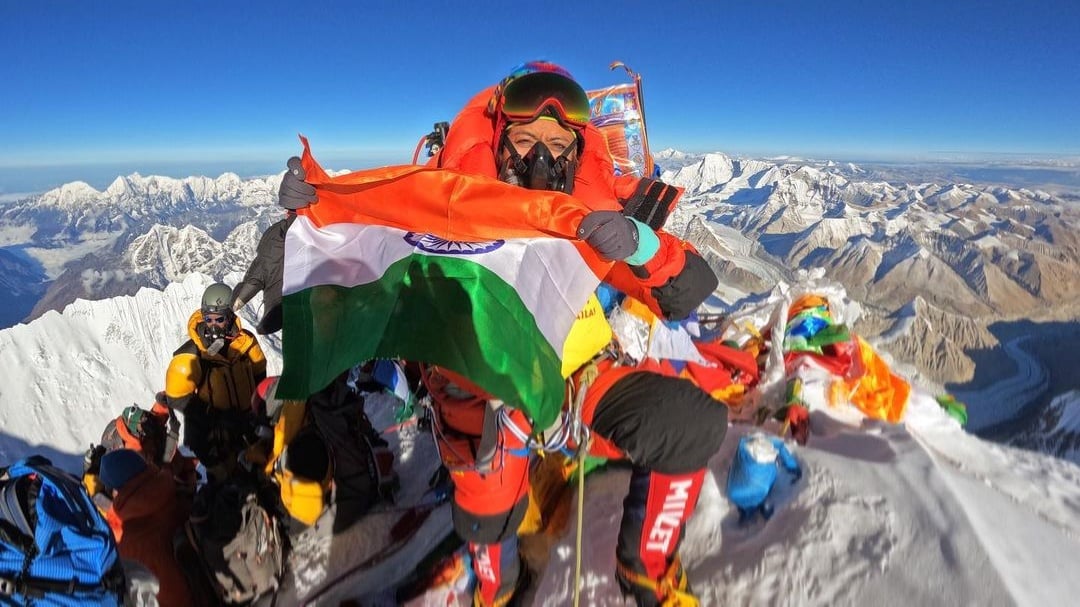 Prakriti Varshney holds the Indian flag at the top of Everest