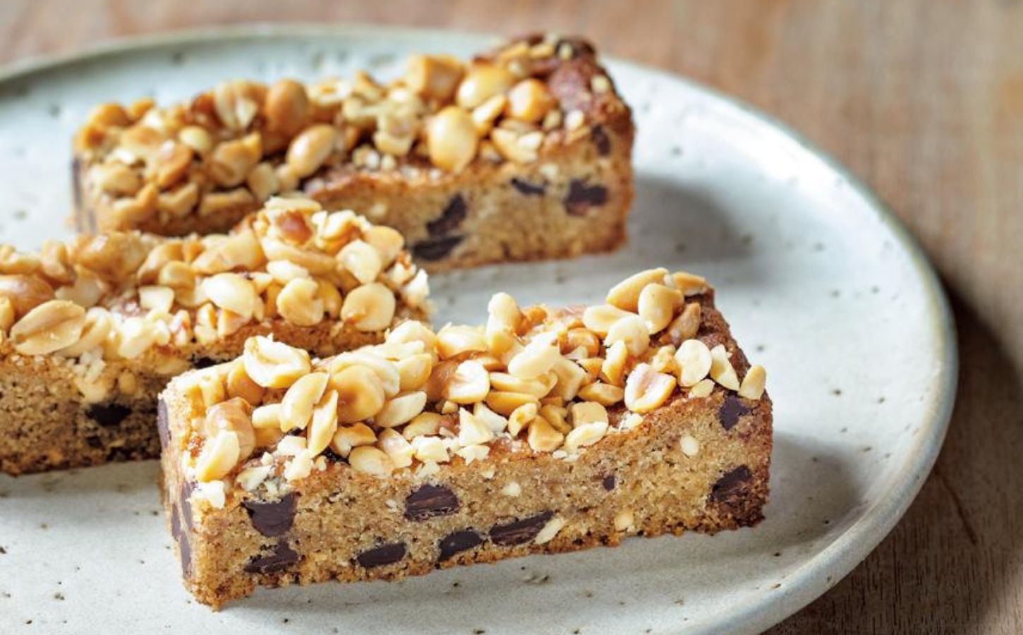 A plate of vegan peanut butter blondie slices