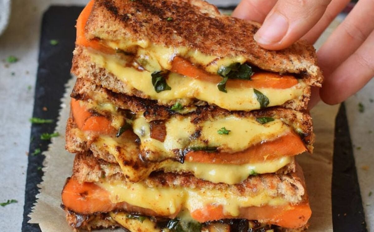 Photo shows a recipe for a vegan grilled sandwich featuring carrots and spinach as well as plant-based cheese