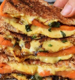 Photo shows a recipe for a vegan grilled sandwich featuring carrots and spinach as well as plant-based cheese