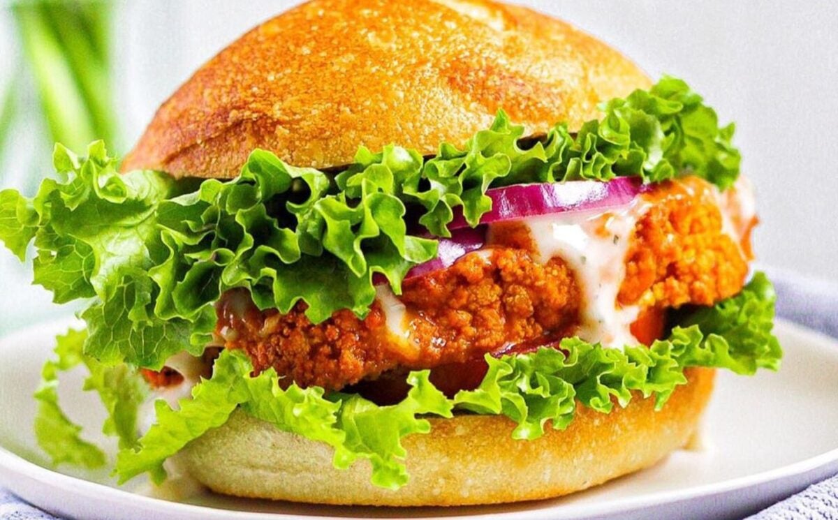 Photo shows a buffalo cauliflower sandwich prepared using a vegan recipe