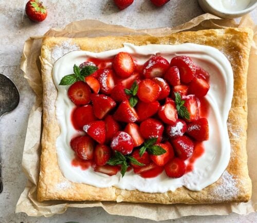 A vegan strawberry galette with dairy-free whipped cream