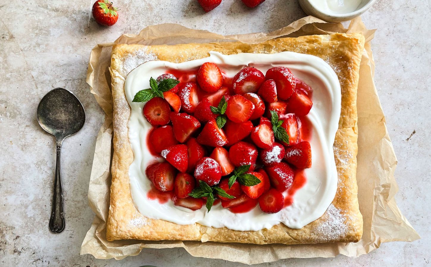 A vegan strawberry galette with dairy-free whipped cream