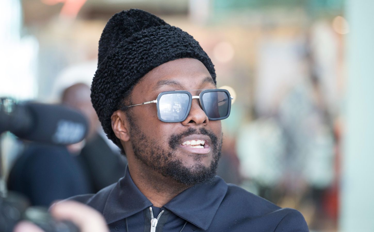 Plant-based celebrity, musician will.i.am smiling